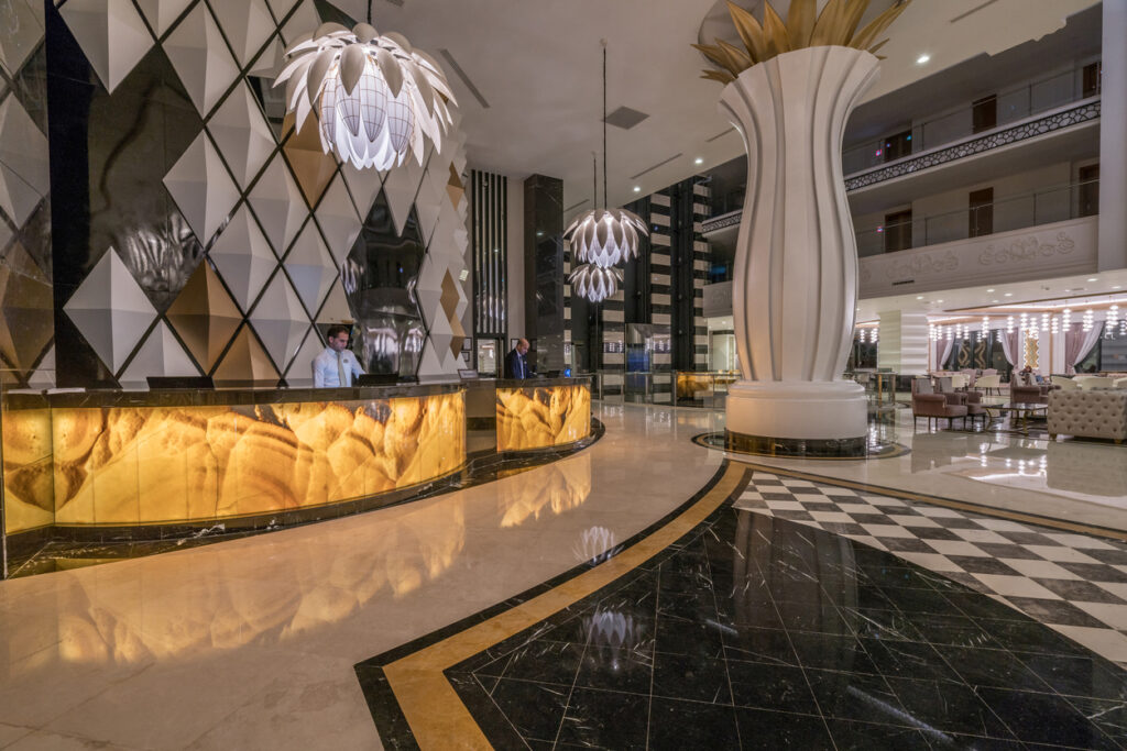 Lobby Entrance With Reception Desk And Lounge Area